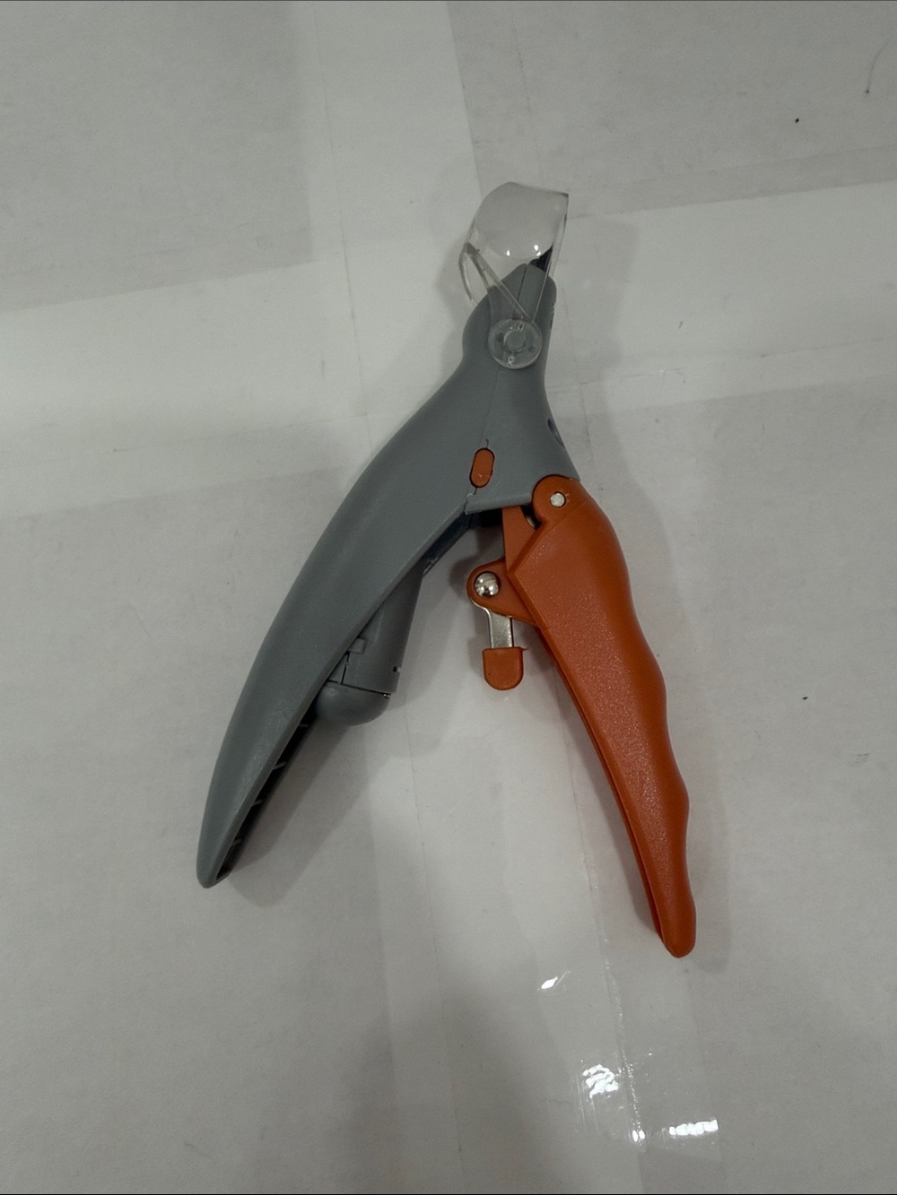Gray and Orange Plastics Dog and Cat Nail Clippers that lights up.